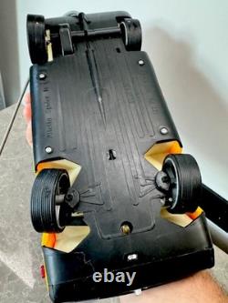 Old remote-controlled Alfa Romeo Alfetta SPIDER with doll box