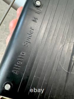 Old remote-controlled Alfa Romeo Alfetta SPIDER with doll box